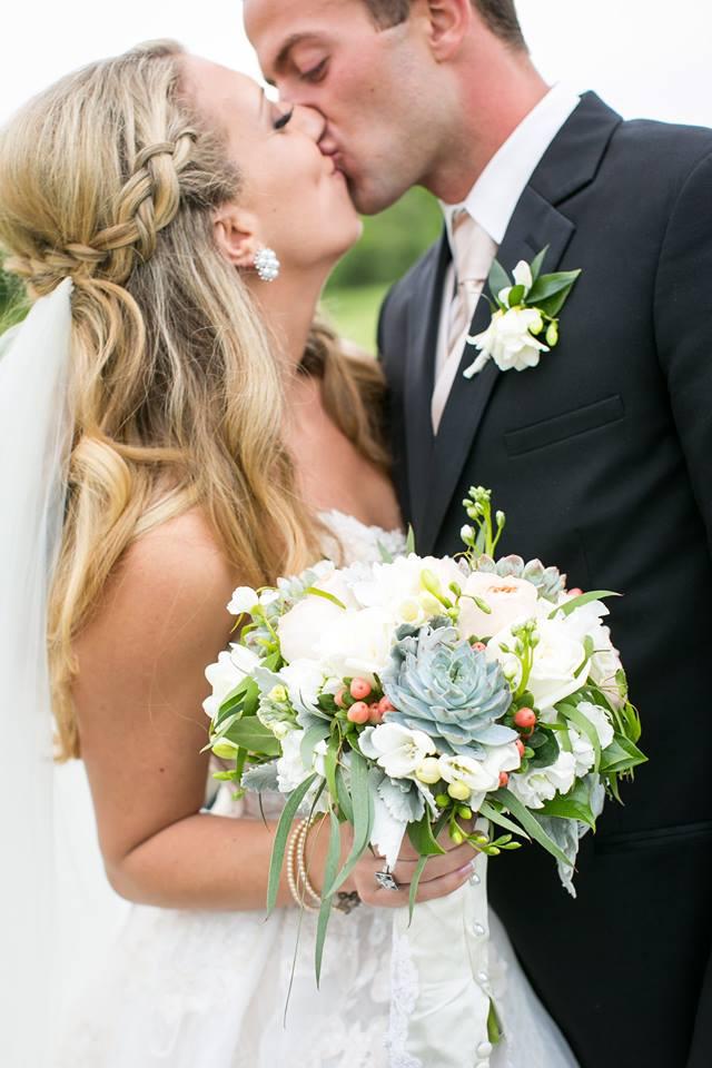 Bride and groom kissing 5-20-2017